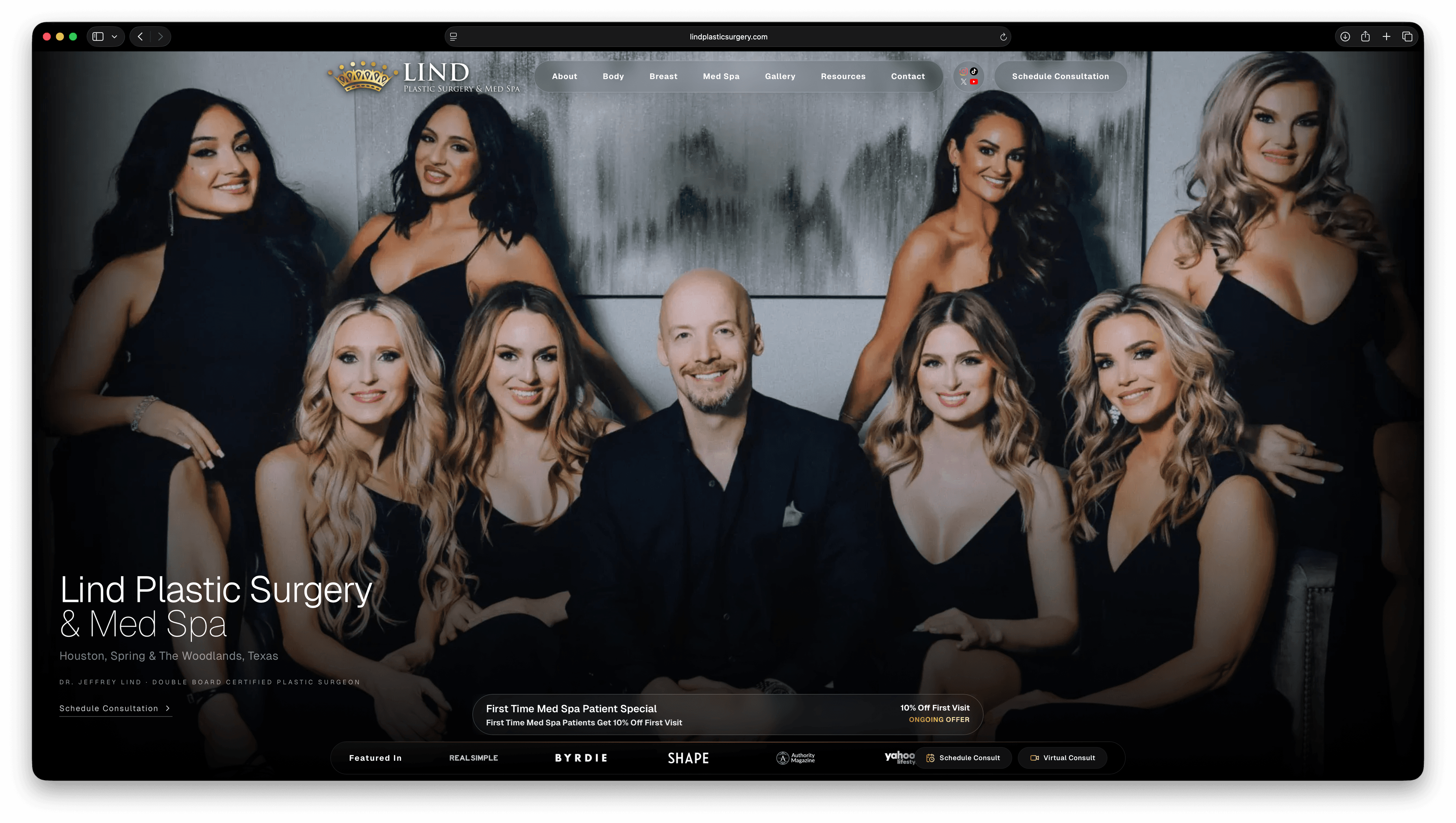 Lind Plastic Surgery & Med Spa homepage, a full-bleed team photograph behind the practice's name